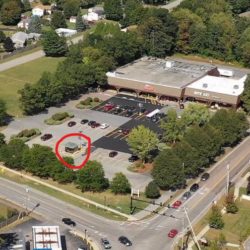 Aerial view of stand-alone ATM building in shopping plaza parking lot Colchester, Vermont