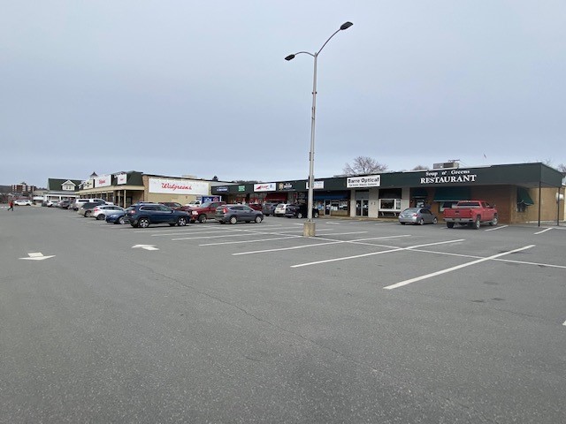 Parking lot view of exterior shopping plaza in downtown Barre, Vermont