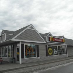 Grey McDonald's building with black shutters