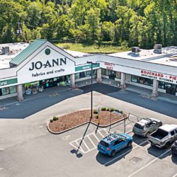 Aerial view of parking lot with Jo-Ann Fabric storefront