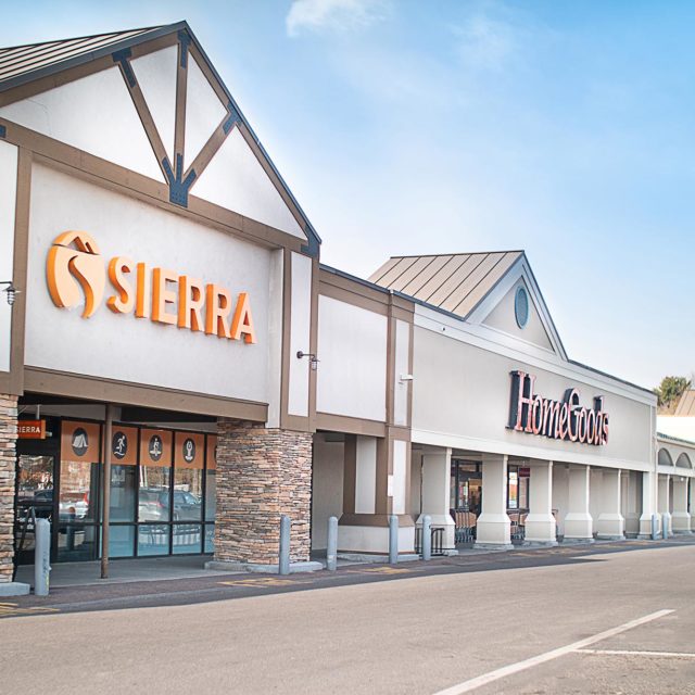 Front view of shopping plaza with Sierra Trading Post and HomeGoods signs