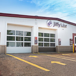 Front view of large garage with Jiffy Lube sign in front