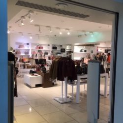 Inside look at clothing store at available retail space, Manchester Retails Outlets