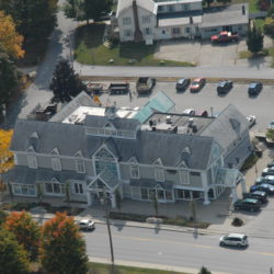 Aerial view of Manchester, VT retail outlet space and parking lot for lease